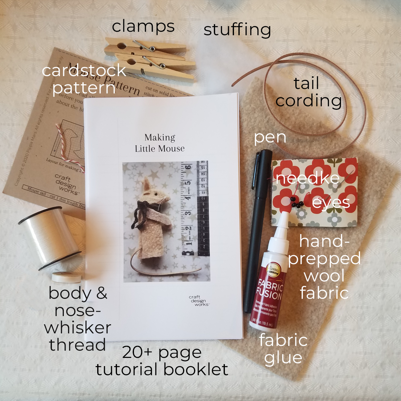 flatlay of crafts kit contents for making finger puppet mice, pattern and all supplies needed to complete 2 finger puppets