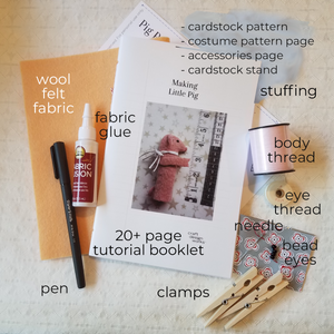 flatlay of contents of crafts kit to make 2 pig finger puppets, pattern and all supplies needed